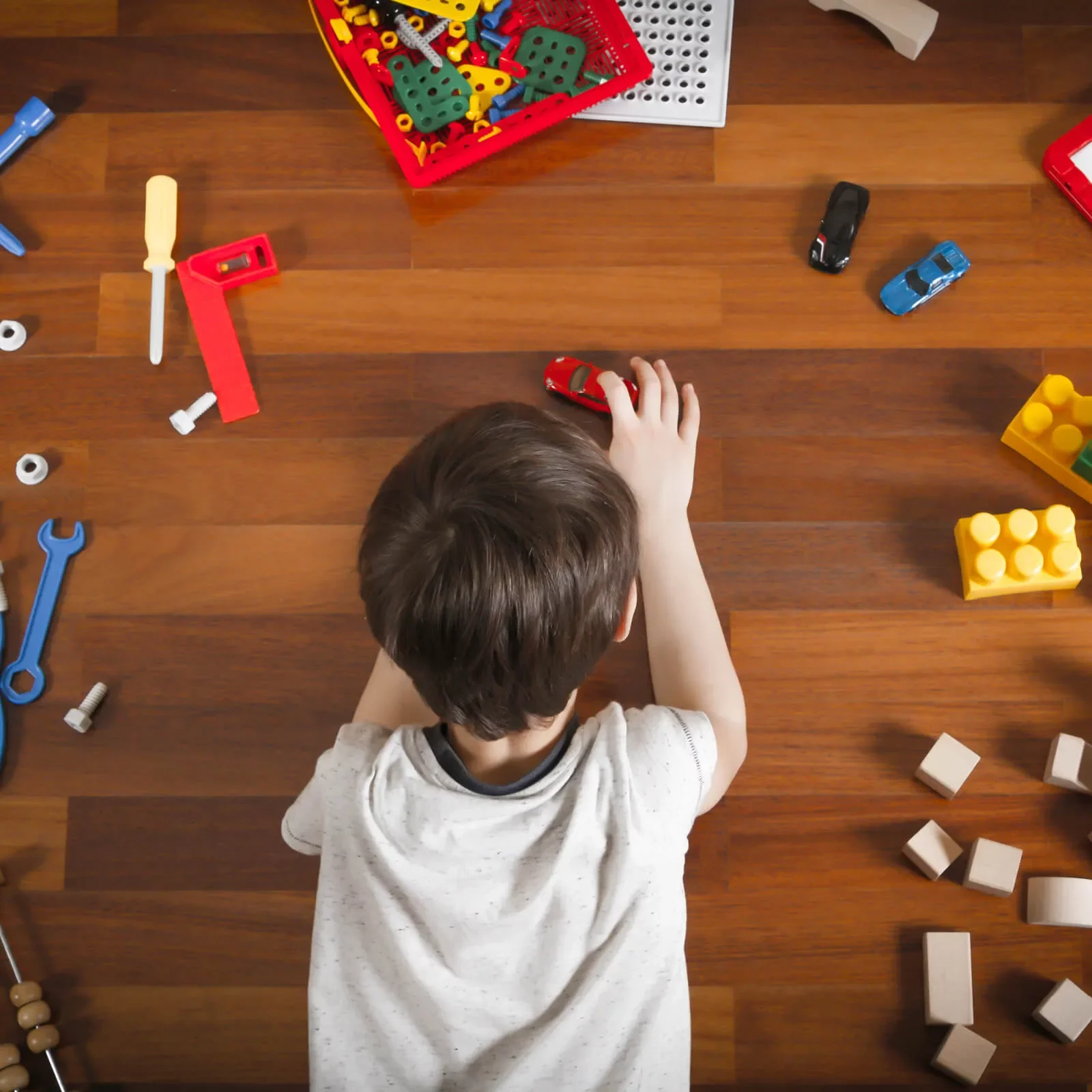 Kid playing with toys | BMG Flooring & Tile Center
